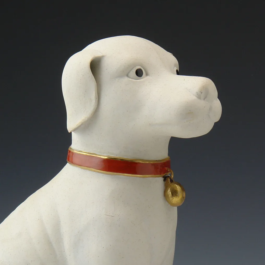 A PAIR OF 11” WHITE DOGS